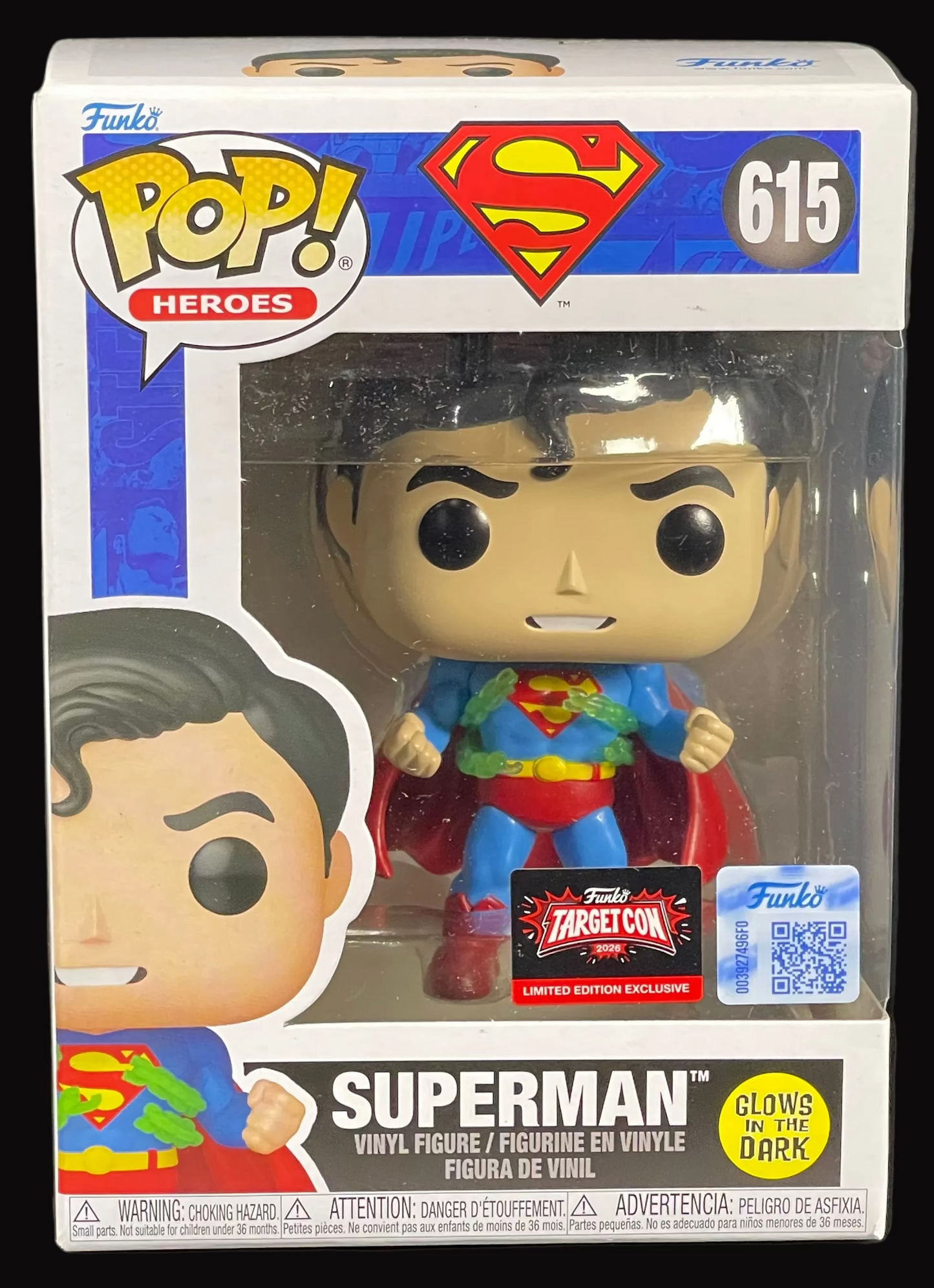 Superman Funko Pop! vinyl figure in packaging on a black stand with a dark background